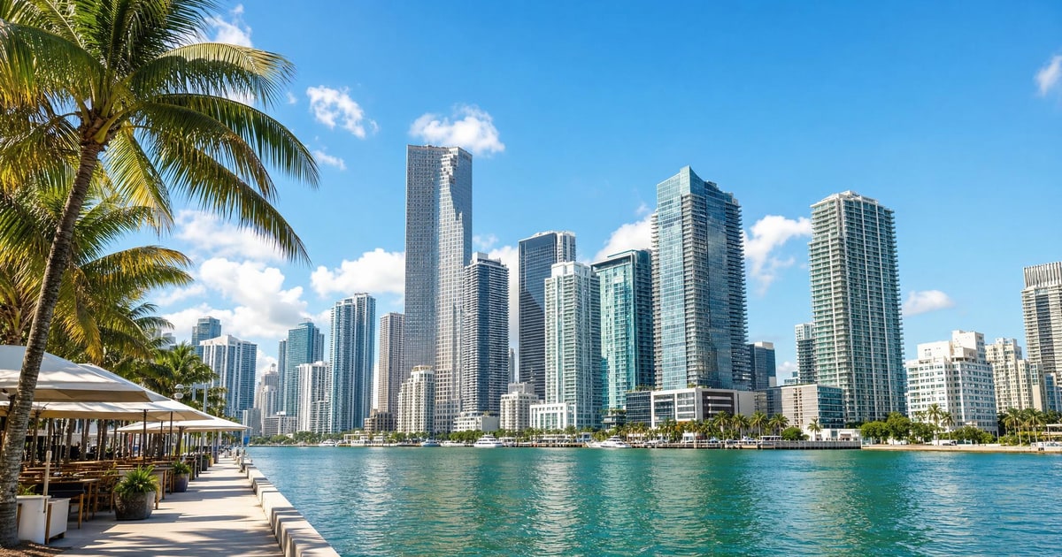Miami skyline over Biscayne Bay with waterfront dining and palm trees.